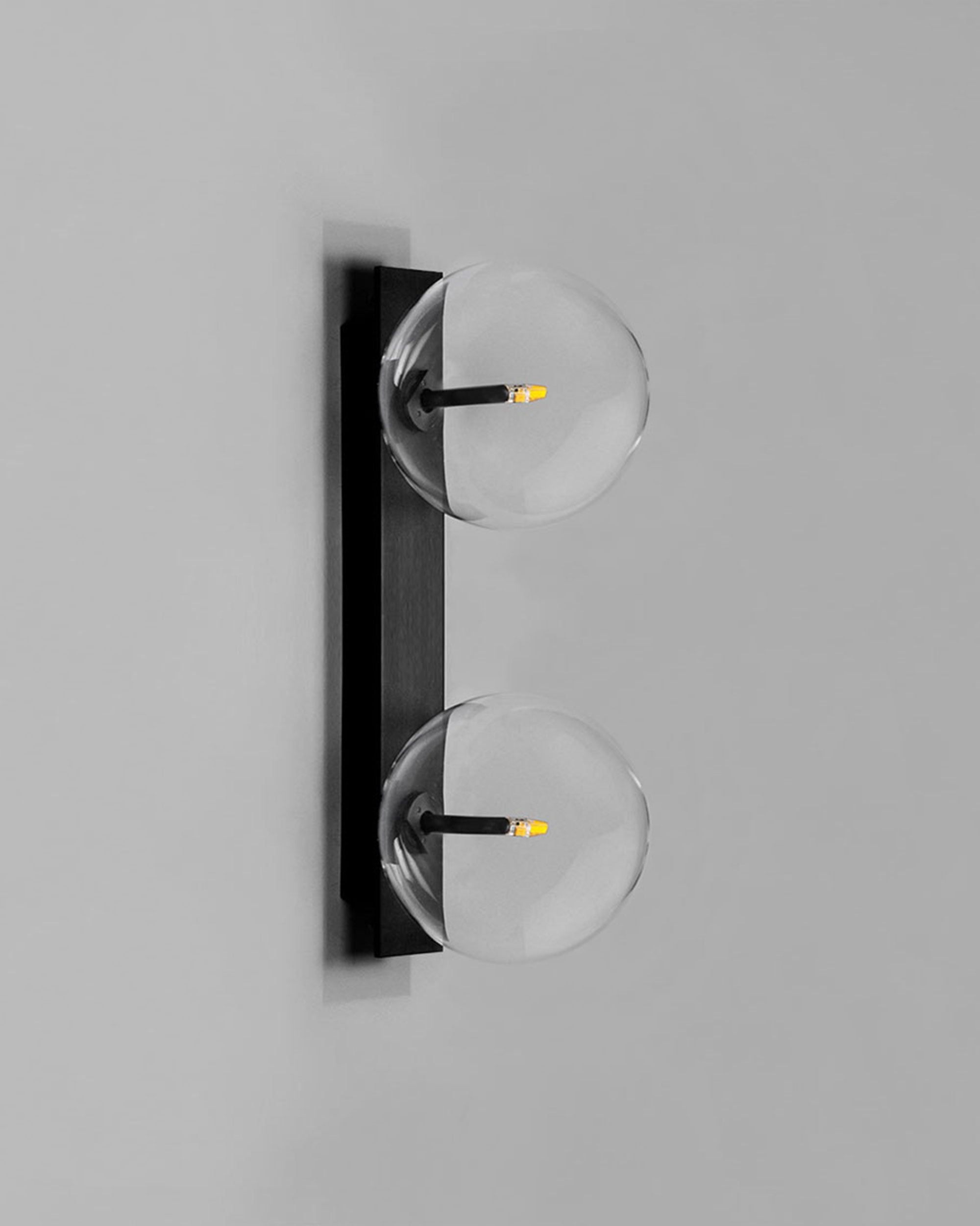Schwung Oslo Dual Black Gunmetal Transparent Globe Wall Light